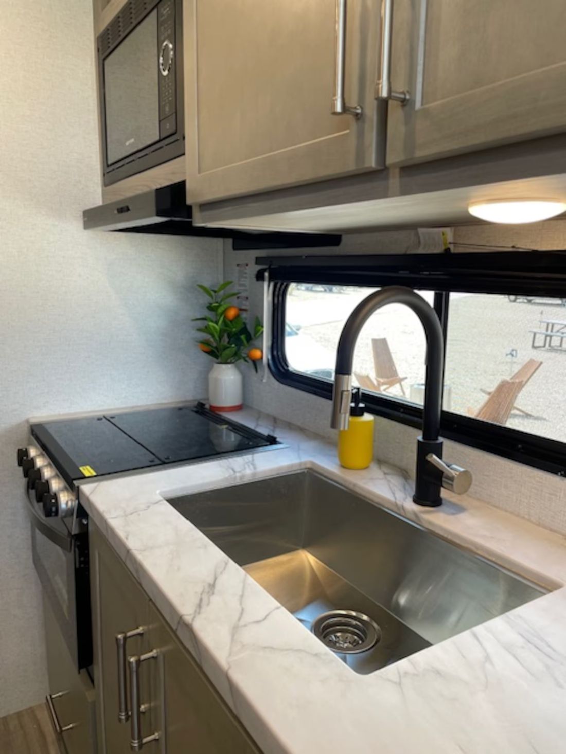 Kitchen with induction cooktop and sink